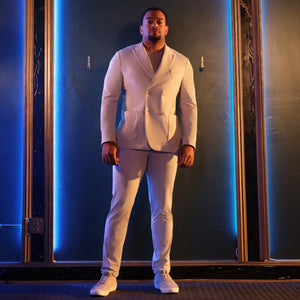 Gui Da Silva wearing cream The Stretch Suit